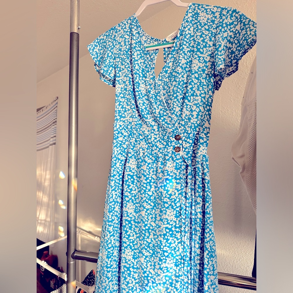 Bright blue dress with white flowers, very cute just doesn’t fit me quite right